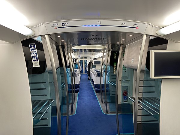 Inside the Airport Express with the Entry/Exit Path, along with the Baggage Compartments. The journey status can be seen above the compartment view.