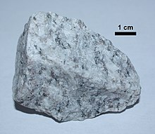 a) Sampling location of leucogranite sample 17NU28 from the