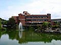 The education building overlooks Chien Tan Pond in a quiet landscape garden that is isolated from the surrounding busy areas of north central Taipei.