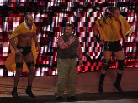 Mantel (center) with The Real Americans, Antonio Cesaro (left) and Jack Swagger
