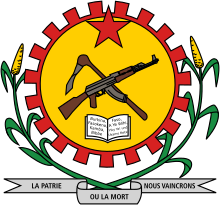 The coat of arms of Burkina Faso under Sankara from 1984-1987, featuring a crossed mattock and AK-47 (an allusion to the Hammer and Sickle) with the motto La Patrie ou la Mort, nous vaincrons
('Fatherland or death, we will win'). A mattock and AK-47 are also featured on the Coat of arms of Mozambique, while the motto below the arms is also the current motto of Cuba, although in Spanish. Coat of arms of Burkina Faso 1984-1991.svg
