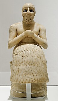 The Statue of Ebih-Il; circa 2400 BC; gypsum, schist, shells and lapis lazuli; height: 52.5 cm, width: 20.6 cm; discovered by André Parrot at the Temple of Ishtar (Mari, Syria); Louvre