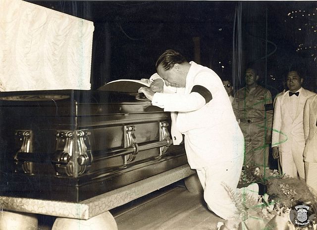 President Elpidio Quirino weeps beside the coffin of his predecessor, Manuel Roxas during the latter's wake in 1948
