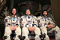 Expedition 34 backup crew members in front of the Soyuz TMA spacecraft mock-up in Star City, Russia.jpg