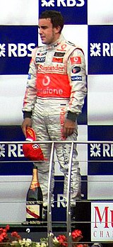 Fernando Alonso 2007 USGP podium.jpg