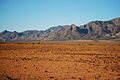 Desert like pastoral land with the Flinders Ranges as a backdrop - Near Wilpena Pound, South Australia