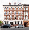 Apartment building in half-open development