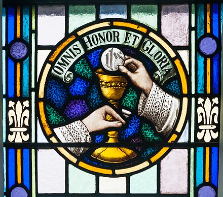 The Eucharistic Doxology in a stained glass window of St. James' in Glenbeigh
