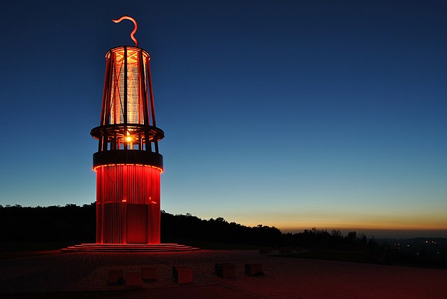The illuminated, 30 meters high mining lamp memorial by Otto Piene on the spoil tip Halde Rheinpreußen in the north of Moers during the blue hour