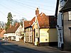 Houses and shops in The Street (A140)