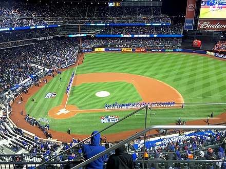 The Met and Cub reserves and coaches stand on the field for introductions before Game 1 at Citi Field.