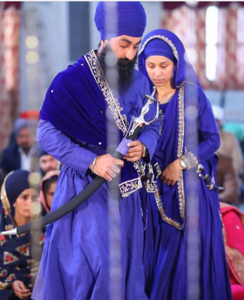 Sikh man and women wearing Turban