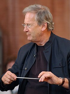 Grammy Award-winning conductor Sir John Eliot Gardiner (CAMS, 1966) John Eliot Gardiner at rehearsal in Wroclaw cropped portrait.jpeg