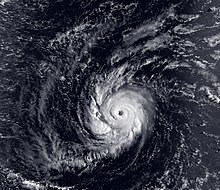 A hurricane in the Central Pacific Ocean, with a circular cloud pattern and clear eye