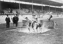The water jump in the men's steeplechase at the 1908 Summer Olympics London 1908 Steeplechase.jpg