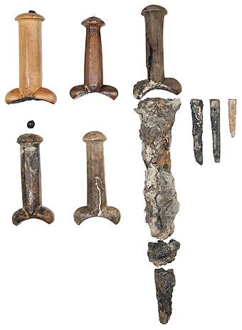 Some of the bollock daggers found on board the Mary Rose; for most of the daggers, only the handles have remained while the blades have either rusted away or have been preserved only as concretions.