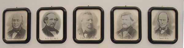 From the mayoral gallery in the municipal hall in Nesna. As first mayor Augustinussen is furthest to the left in the picture. The next four are Fredrik Christian Sand, Elias Olsen, Jacob Fredrik Zahl and Carl Josevold. Nesnaordforere.jpg