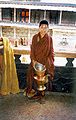 Novice monk with teapot. Tashilunpo, Tibet