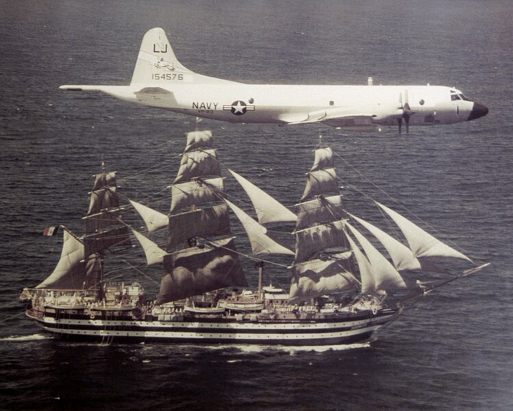 File:P-3B VP-23 with sailing ship Amerigo Vespucci 1976.jpeg