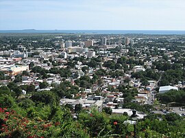 Ponce, Puerto Rico, with the Caribbean Sea in the background Partial view of the City of Ponce, looking SSW from Cerro El Vigia, Barrio Portugues Urbano, Ponce, Puerto Rico.jpg