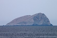 The islet of Pondikonisi, mouse island, which is shaped like a mouse. Pondikonisi (cropped)01.jpg