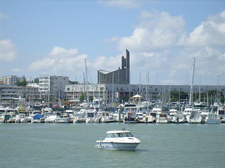 View of the harbour and the modernist church Notre-Dame.