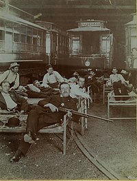 Posse members resting on cots in the United Railway car barn during the Streetcar Strike of 1900.jpg