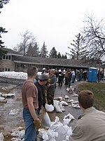 A line of sandbagging volunteers in Fargo, North Dakota. Sandbagging line Fargo 2009.JPG