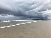 A summer storm rolls in over Waratah Bay, Sandy Point Sandy Point beach.jpg