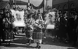 A crowd in Skopje on 20 April 1941 celebrating the entry of the Bulgarian Army and displaying banners praising the Axis invasion in Macedonia. Skopje, 20 April 1941.jpg