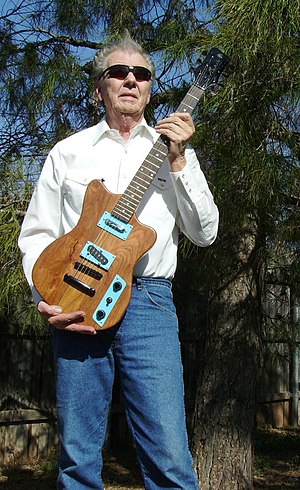 Sonny West with guitar he made from Texas Mesquite wood.jpg