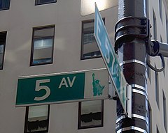 Fifth Avenue and E. 57th Street in Manhattan Street sign at corner of Fifth Avenue and E 57th Street in NYC.jpg