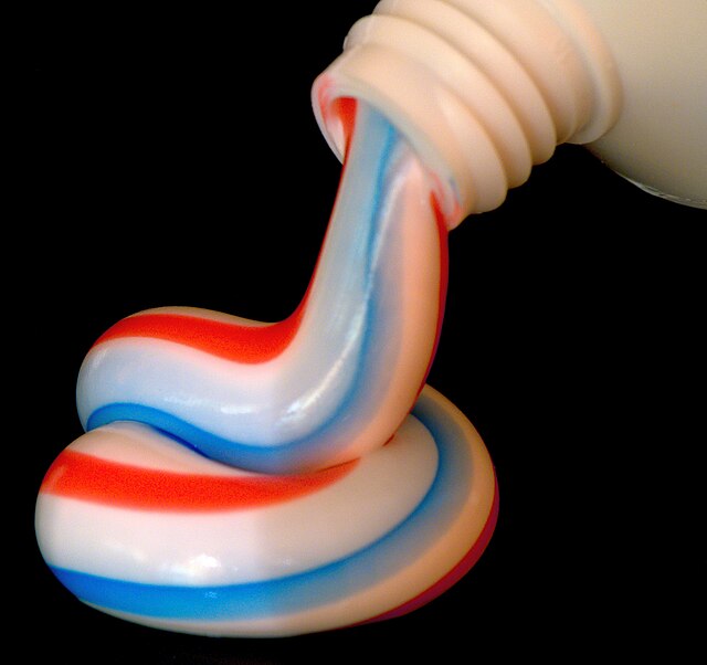 A brand of red, blue and white striped toothpaste