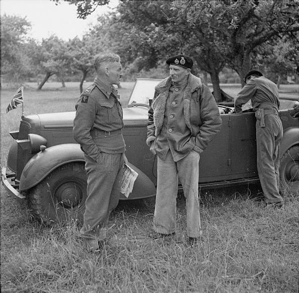 General Sir Bernard Montgomery in conversation with Major General Douglas Graham, GOC 50th (Northumbrian) Infantry Division, pictured here in Normandy