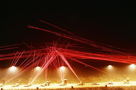 Tracer fire lights up the night sky at Marine Corps Base Camp Pendleton as recruits engage targets during a night-fire exercise.