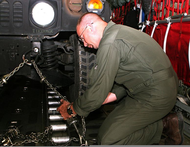 File:U.S. Marine Corps Gunnery Sgt. Jason E. Vanevery, loadmaster with Black Sea Rotational Force 11, secures cargo to the deck of a KC-130 Hercules aircraft at Mihail Kogalniceanu Airfield in Constanta, Romania 110502-M-OB762-004.jpg