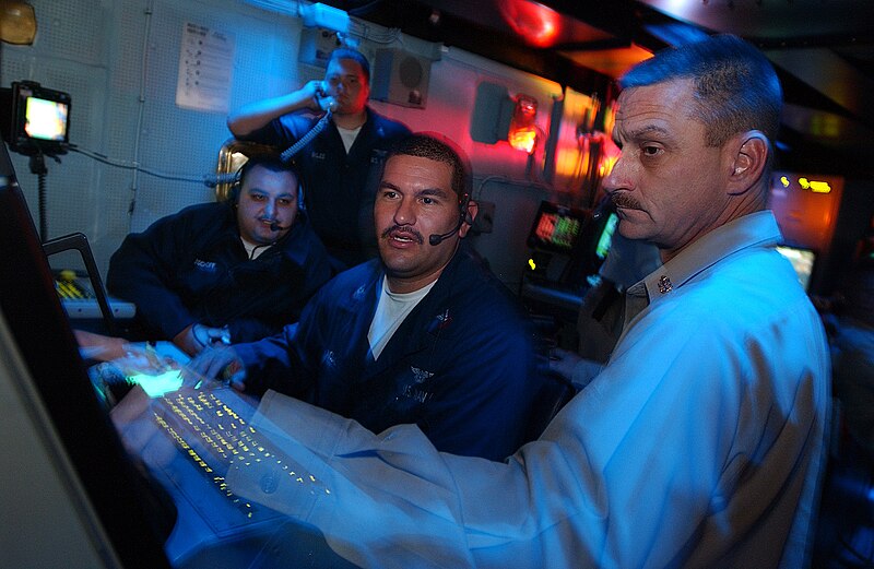 File:US Navy 040606-N-2788L-042 USS Ronald Reagan (CVN 76) Chief Air Traffic Controller James Jones, of Jacksonville, Fla., discusses the status of the ship's aircraft with Air Traffic Controller 1st Class Rene Nodal.jpg