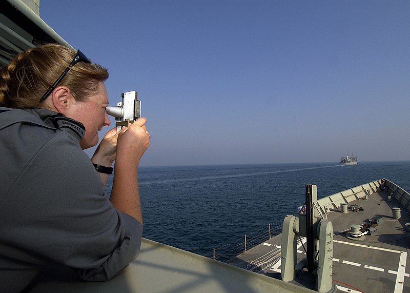 File:US Navy 040929-N-7034S-004 An Officer assigned to the Royal Australian Navy, uses a sextant to measure the distance between her ship, HMAS Adelaide (FFG 01), and the fast combat support ship USS Seattle (AOE 3).jpg