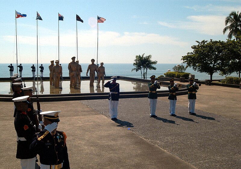 File:US Navy 041020-N-0493B-003 Backed by a monument marking the location of Gen. Douglas MacArthur's return to the Philippines 60 years ago, a Philippine Marine Corps honor guard stands at attention during the playing of Taps.jpg