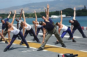 US Navy 060627-N-5290S-109 Gilad of the Fit TV show, Bodies in Motion, films a show aboard the amphibious assault ship USS Bonhomme Richard (LHD 6). Sailors participated in the filming on the flight deck during Rim of the Pacif.jpg
