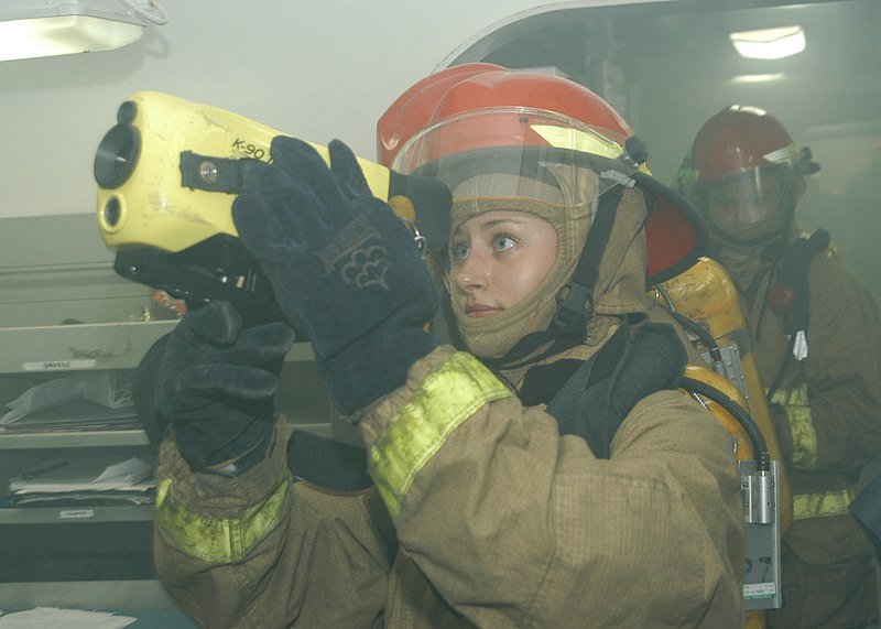 File:US Navy 110630-N-JO245-062 Damage Controlman 3rd Class Courtney Fuller scans a smoke-filled room for hot spots and the source of a simulated fire w.jpg