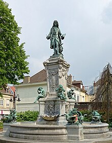 Bronzen beeld dat Antoine Watteau voorstelt, in Valenciennes.