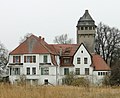 Manor complex with manor wing, farm and water tower building, and park