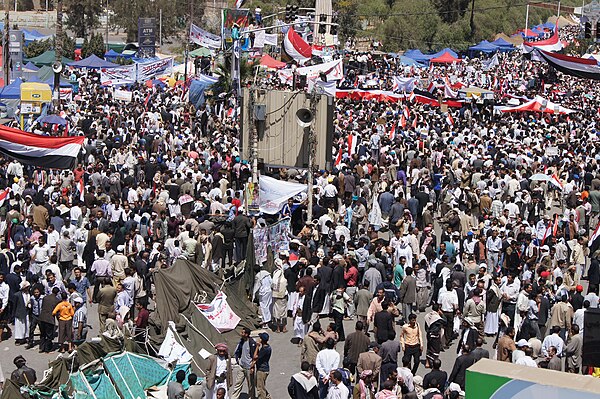 Tens of thousands of protesters marching to Sana'a University, joined for the first time by opposition parties