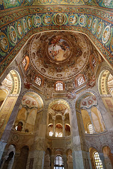 Interior of the octagonal room of the Basilica of San Vitale in Ravenna showing the hemispherical dome, windows in the drum beneath it, and several of the eight tall arches niches with small semi-domes aligned with those windows