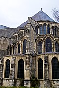 In the basilica built ca. AD 1170 at the Abbey of Saint-Remi, in France a flying buttress system is used for lateral-support