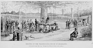 Meeting of the Transylvania House of Delegates. Anonymous sketch of the constitutional convention meeting "under the shade of a huge elm tree (the limbs of which extended at least a hundred feet wide)", convened by Richard Henderson. Boonesborough, Kentucky 30 grey.jpg