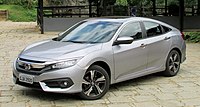 The proposed one. Its a sedan, yes, however that doesn't matter. As long as the image is of good quality and is at the correct lighting, then it means it can be used. Doesn't matter if its a hatchback or sedan, either way both are equally fine. Also sedan was released first in 2016, then the hatchback, so the 'tradition of Civics' is not a good excuse for reverting or replacing