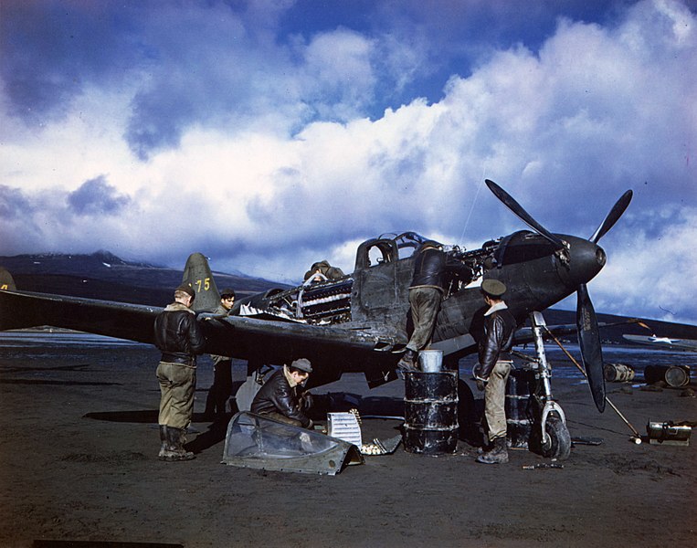 File:C-878 - Maintenance crew repair a P-39 on an airfield in the Aleutian Islands, Alaska. (52286672997).jpg