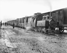 Transfer of ammunition from standard-gauge railway to trench railway during the Battle of Passchendaele. C01357-military rail transport Frizeville 1917.jpg